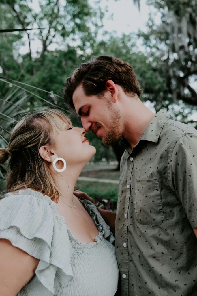 A couple gently touching their noses together while smiling. To heal & empower your relationship, begin working with an anxiety therapist in NYC, NY. Our NYC anxiety therapy can help! 