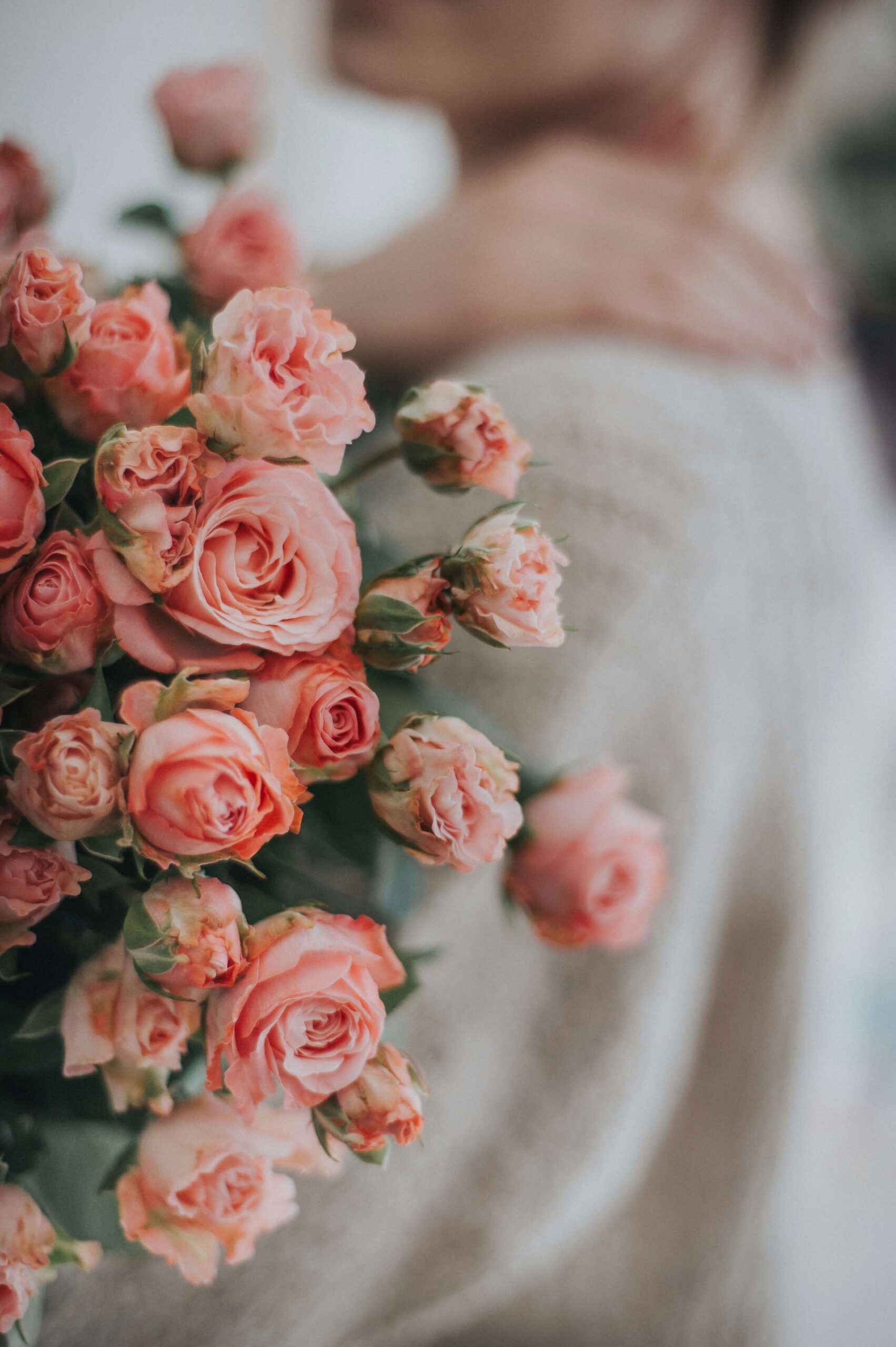 A woman holding a bouquet of pink roses. Anxiety counseling in NYC, NY can help you improve your well-being. Begin working with an anxiety therapist today.