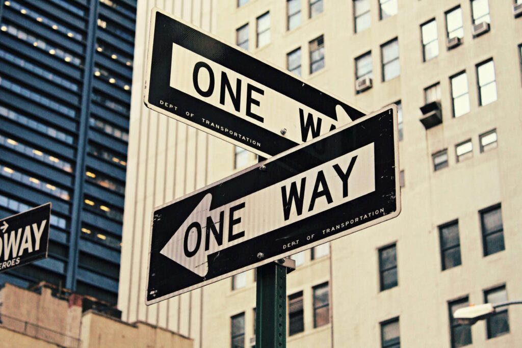 Two road signs that read "ONE WAY" but pointing in different directions. If you recently graduated from college & find yourself anxious for next steps, get started with anxiety counseling in NYC, NY. Call now!