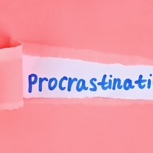 A pink piece of paper being ripped & revealing the word "procrastination" in marker. Anxiety counseling in NYC, NY can help you find balance in your life. Don't let anxiety & procrastination hold you back any longer!