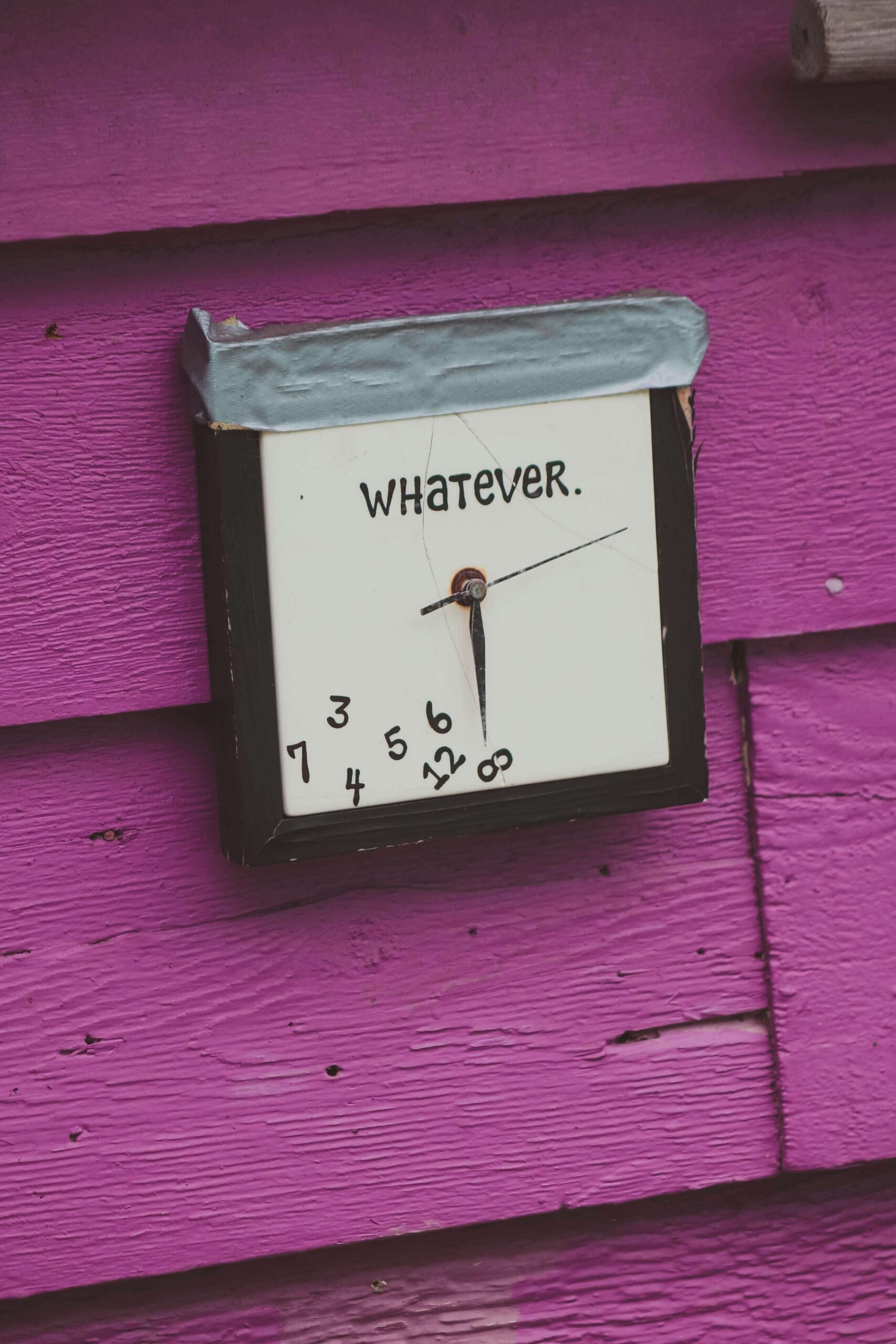 A square clock that says "whatever" & the numbers have fallen to the bottom. This represents how procrastination can create more anxiety when feeling like your to-do list isn't finished. Work with an anxiety therapist in NYC, NY today to help.