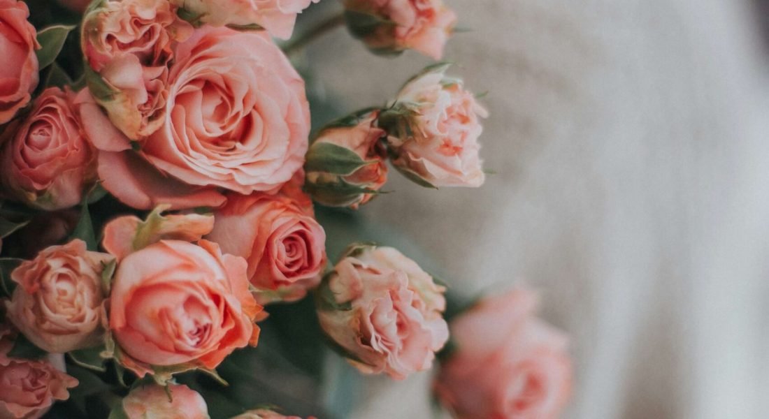 A woman holding a bouquet of pink roses. Anxiety counseling in NYC, NY can help you improve your well-being. Begin working with an anxiety therapist today.